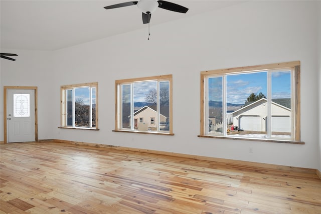 interior space with high vaulted ceiling, ceiling fan, and wood-type flooring