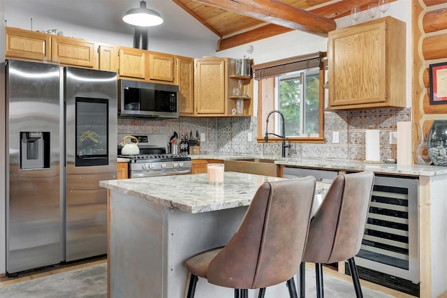 1081 Old Barn Rd, Seeley Lake, MT 59868 - kitchen with stainless steel appliances, wine cooler, light stone countertops, tasteful backsplash, and a wood ceiling with exposed beams
