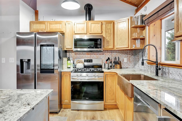 1081 Old Barn Rd, Seeley Lake, MT 59868 - kitchen featuring appliances with stainless steel finishes, open shelves, tasteful backsplash, light brown cabinets, and light stone counters