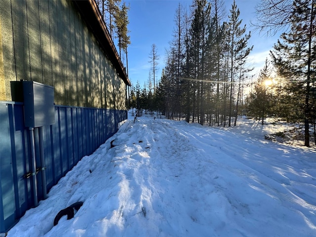 view of yard layered in snow