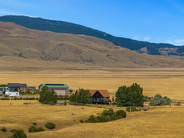 mountain view featuring a rural view