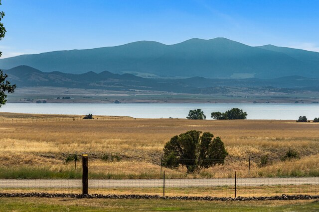 view of mountain feature featuring a water view