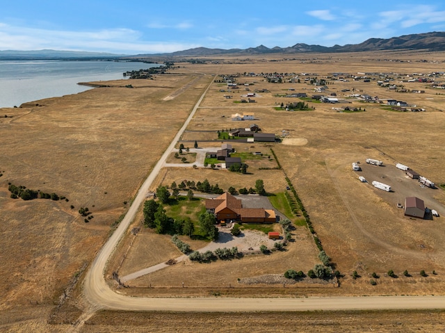 drone / aerial view with a rural view and a water view