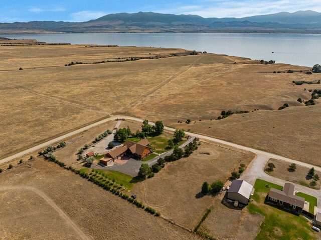 birds eye view of property with a rural view and a water and mountain view