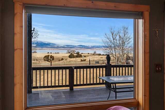wooden deck featuring a water view