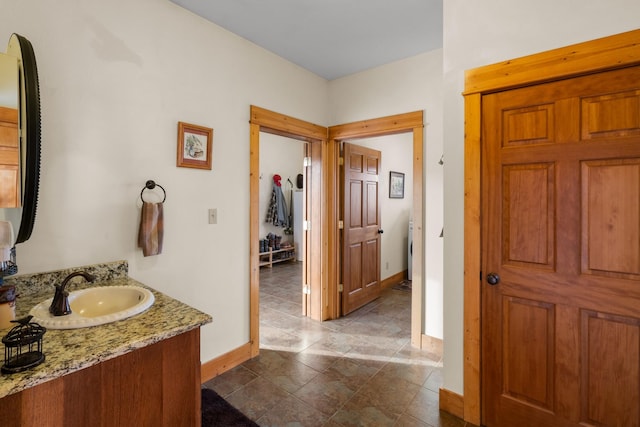bathroom with vanity and baseboards