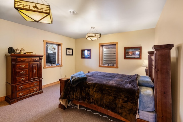 carpeted bedroom with baseboards