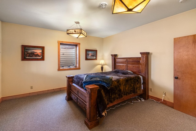 carpeted bedroom with lofted ceiling and baseboards