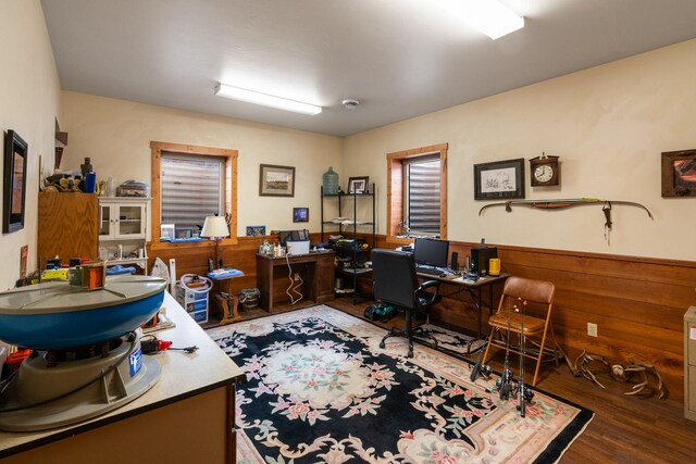 office area featuring wood finished floors, a wainscoted wall, and wood walls