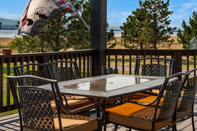wooden deck with outdoor dining area