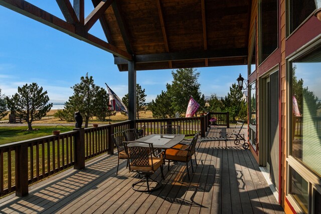 wooden terrace with outdoor dining space
