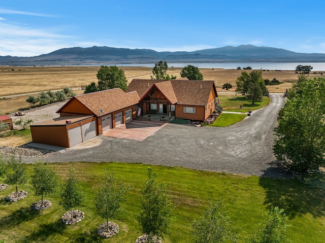 birds eye view of property featuring a water and mountain view