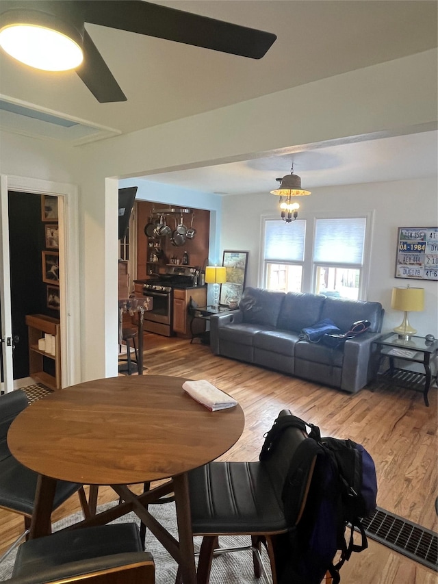 dining room featuring a notable chandelier and wood finished floors