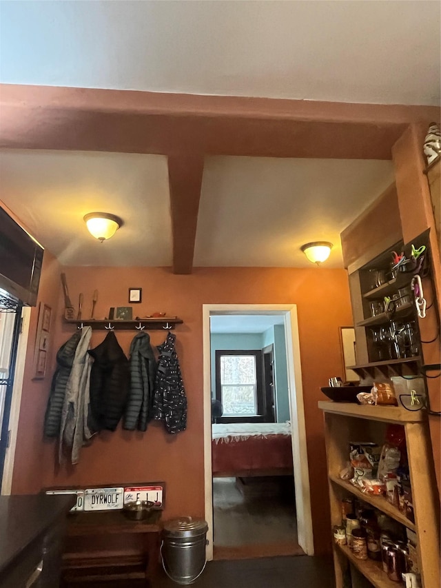 mudroom with beamed ceiling