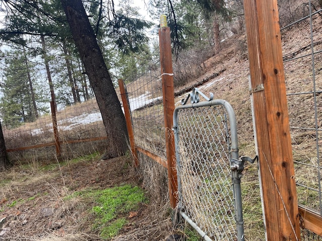 view of gate with fence