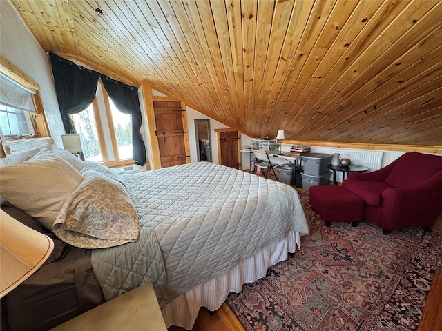 bedroom with wood finished floors, lofted ceiling, and wooden ceiling