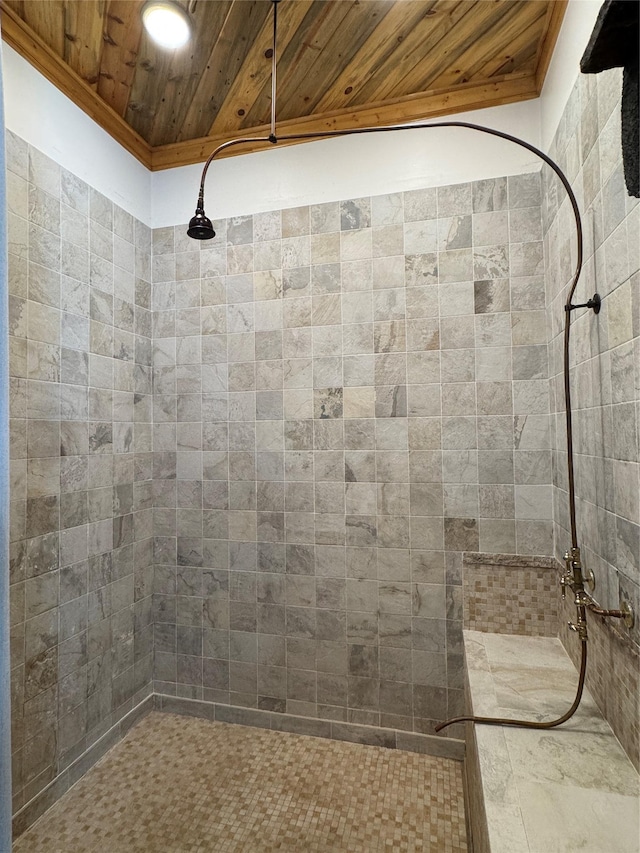 bathroom featuring tiled shower and wood ceiling