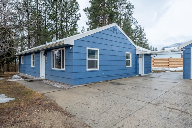 ranch-style house with fence