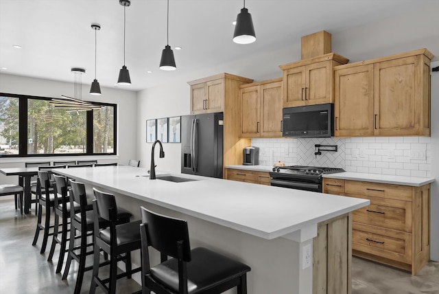 kitchen with fridge with ice dispenser, a sink, backsplash, gas stove, and concrete flooring