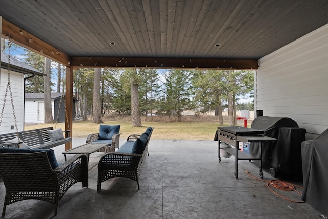 view of patio / terrace featuring an outbuilding and outdoor lounge area