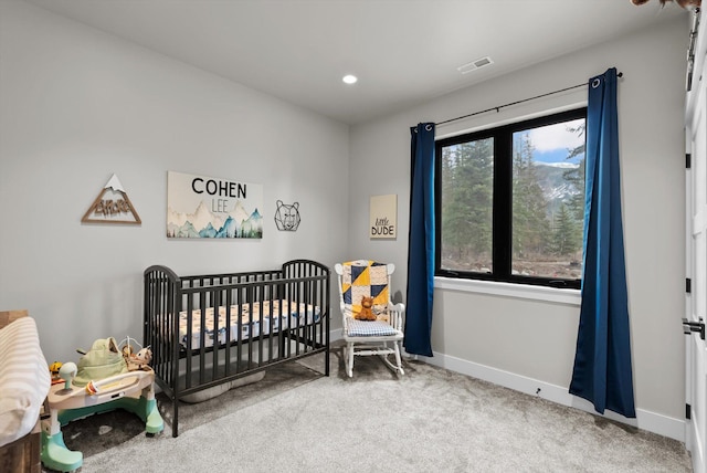 bedroom with visible vents, recessed lighting, carpet floors, a nursery area, and baseboards