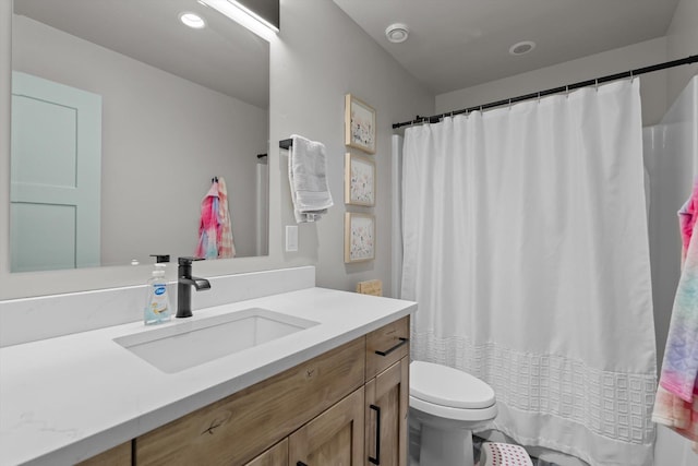 bathroom with vanity, toilet, and a shower with curtain