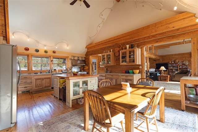 17 Mountain View Rd, Trout Creek, MT 59874 - dining space with rustic walls, ceiling fan, high vaulted ceiling, and light wood-style flooring