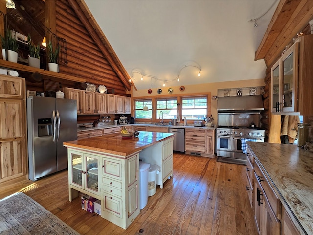 17 Mountain View Rd, Trout Creek, MT 59874 - kitchen featuring appliances with stainless steel finishes, wood counters, light wood-type flooring, open shelves, and glass insert cabinets