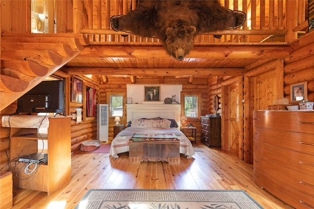 17 Mountain View Rd, Trout Creek, MT 59874 - bedroom with log walls, wood-type flooring, and beam ceiling