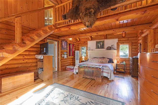 17 Mountain View Rd, Trout Creek, MT 59874 - bedroom with rustic walls, multiple windows, hardwood / wood-style flooring, and a wooden ceiling with exposed beams