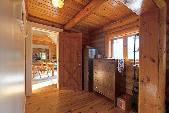 17 Mountain View Rd, Trout Creek, MT 59874 - bedroom with log walls, light wood-style flooring, multiple windows, and a wood ceiling with exposed beams