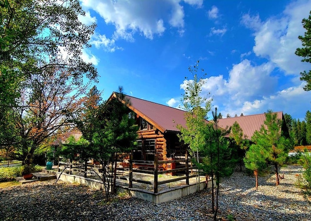 17 Mountain View Rd, Trout Creek, MT 59874 - rear view of house with a metal roof and log exterior