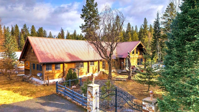 17 Mountain View Rd, Trout Creek, MT 59874 - log-style house featuring a gate, log siding, and a metal roof