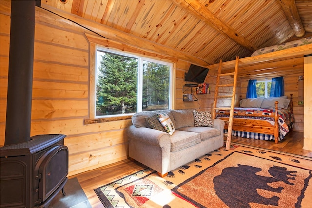 17 Mountain View Rd, Trout Creek, MT 59874 - living room featuring wood finished floors, wood walls, wooden ceiling, and a wood stove