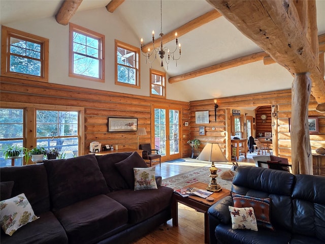 17 Mountain View Rd, Trout Creek, MT 59874 - living room with log walls, hardwood / wood-style floors, high vaulted ceiling, plenty of natural light, and a chandelier