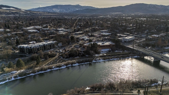 bird's eye view with a water and mountain view