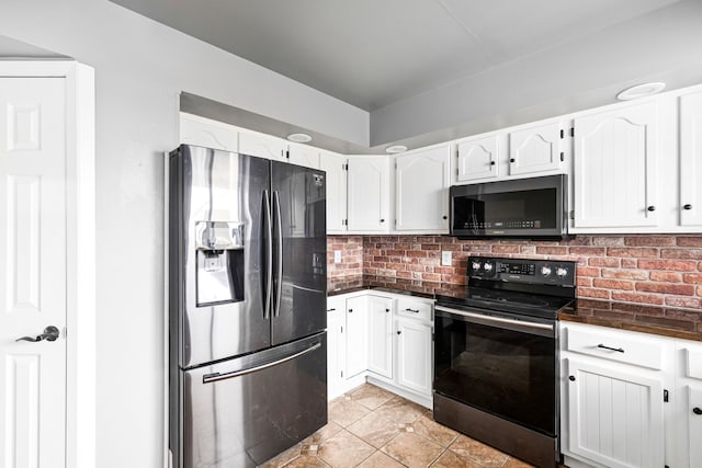 kitchen featuring black range with electric stovetop, dark countertops, stainless steel fridge with ice dispenser, and white cabinets