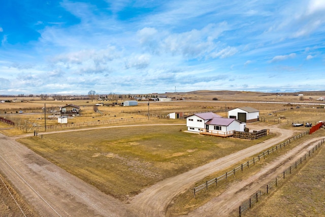 birds eye view of property featuring a rural view