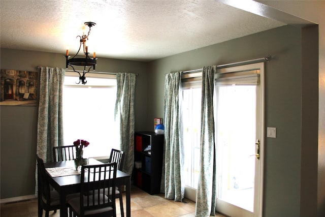 3004 Green Cir, Butte, MT 59701 - dining space featuring plenty of natural light, a textured ceiling, and light tile patterned flooring
