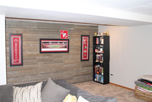 3004 Green Cir, Butte, MT 59701 - carpeted living room featuring wood walls and baseboards