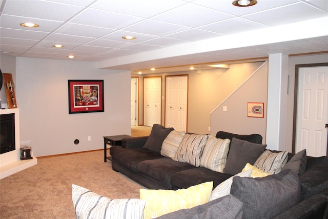 3004 Green Cir, Butte, MT 59701 - carpeted living area featuring recessed lighting, a drop ceiling, baseboards, and a fireplace with raised hearth