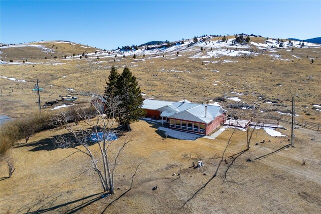 birds eye view of property with a mountain view