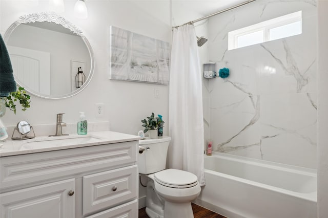 bathroom featuring vanity, shower / tub combo, toilet, and wood finished floors