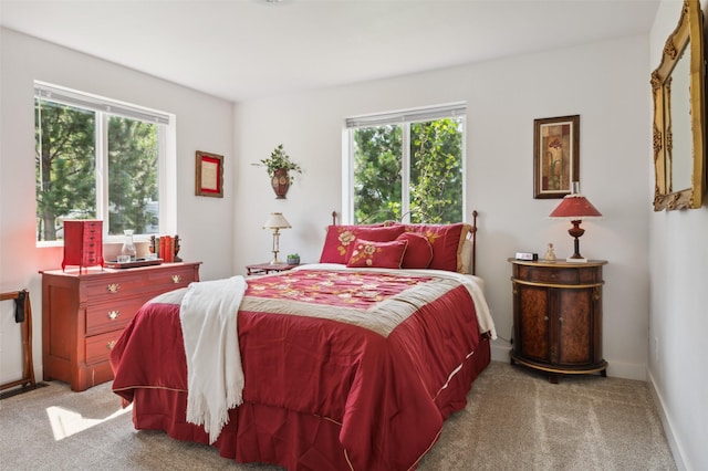 carpeted bedroom featuring visible vents and baseboards