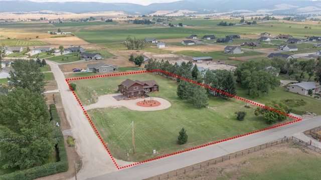 birds eye view of property with a rural view