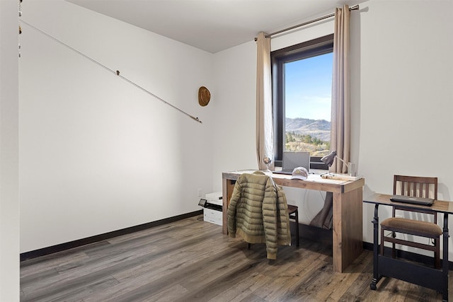 office space featuring wood finished floors and baseboards