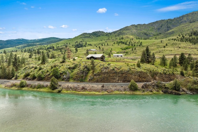 bird's eye view with a water and mountain view