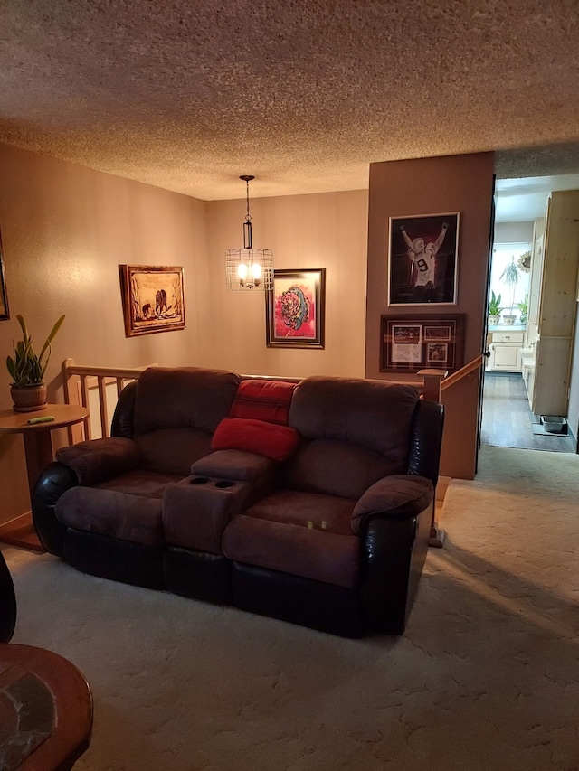 carpeted living room with a textured ceiling