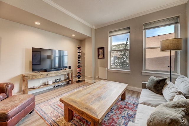 living area with recessed lighting, crown molding, baseboards, and wood finished floors