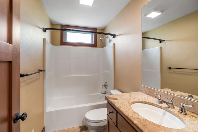 bathroom with vanity,  shower combination, and toilet